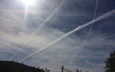 Airplane tracks covering my sky like a spiderweb
